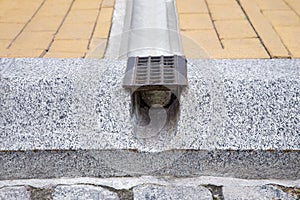 Drainage grate system, grill for removal of rainwater from stone walking paths.