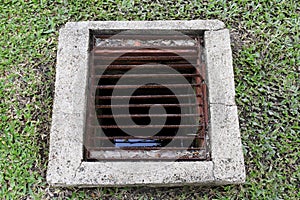 Drainage hole grating for water dirt old, Drain sewer pipe cement of dirty water waste on the lawn floor, Drainage hole cement