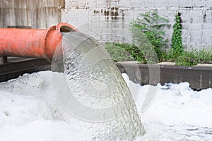Drainage pipe with water flowing into the river