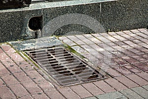 Drainage of rainwater a hole in the wall of the granite facade.