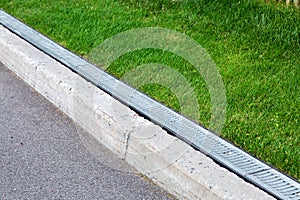 Drainage system along an asphalt road.