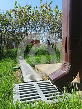 Drainage systems. idea - building a house, storm taps. metal construction from the roof - sewer and grate on the ground for