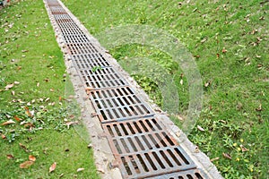 drainage systems. metal structures for water drainage. sewerage grate on the ground.