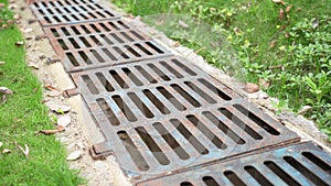 drainage systems. metal structures for water drainage. sewerage grate on the ground.