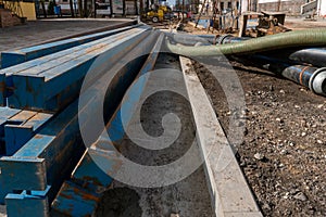 Drainage works on the construction site. Pumping groundwater from dug trenches during the laying of a new pipeline. Sewer repair