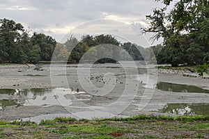 Drained pond. Lake without water. Water scarcity.