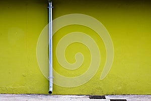 Drainpipe on a Green Wall