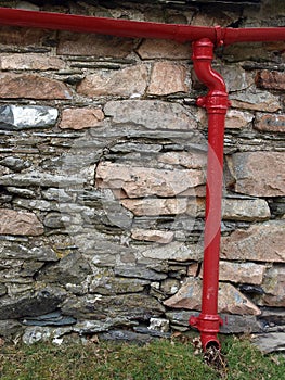 Drainpipe on rustic building