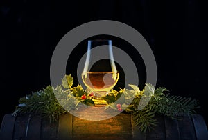 Dram of Whisky in  Nosing Glass atop Whisky Cask photo