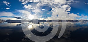 Dramatic Aerial Panorama of Clouds and Mountain Landscape. Nature Background.