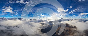 Dramatic Aerial Panorama of Clouds and Mountain Landscape. Nature Background.