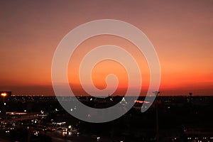 Dramatic aerial view of countryside summer twilight sky with silhouette building.