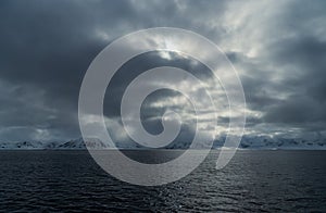 Dramatic arctic landscape in Svalbard. In the foreground the Greenland Sea.