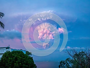 The dramatic ash plume of a volcano eruption in the Philippines.