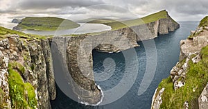 Dramatic atlantic rocky coastline cliffs landscape in Vagar. Faroe