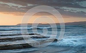 Beautiful dramatic Sunset over a rocky coast