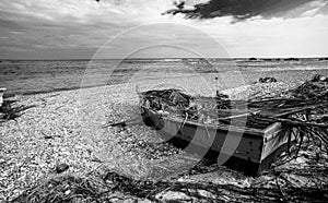 Dramatic black and white image of wooden fishing boats on the caribbean coast in Los Patos, dominican republic.