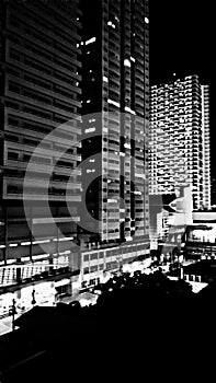 A dramatic black and white night view of Cityland and Zitan Condominiums in Mandaluyong, Philippines.