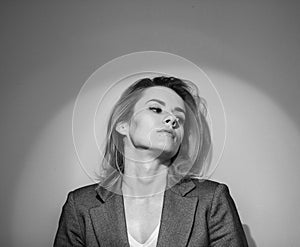 Dramatic black and white portrait of a beautiful woman on a dark background