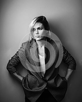 Dramatic black and white portrait of a beautiful woman on a dark background