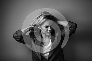 Dramatic black and white portrait of a beautiful woman on a dark background