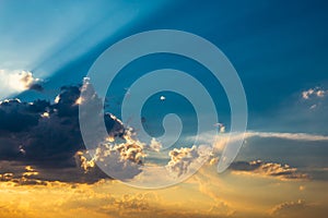 Dramatic blue sky with clouds and rays of sun, atmosphere cloudscape background