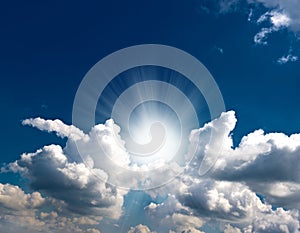 Dramatic blue sky with clouds and sun rays