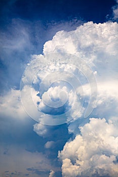 Dramatic blue sky with white stormy clouds before the rain.