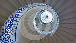 Dramatic blue spiral staircase