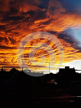 dramatic and burning sky over the old town