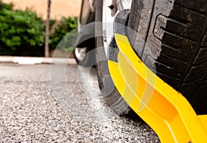 Dramatic car tire with yellow boot