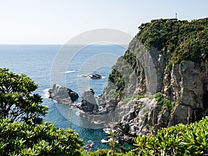 Dramatic cliffs of Cape Ashizuri with viewing platform on top