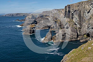 The dramatic cliffs at Mizen Head, County Cork, Ireland where the Atlantic Ocean crashes against the rocks