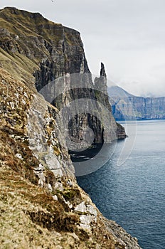 Dramatic cliffs Trollkonufingur, the witches finger, in Faroe Islands, Northern Europe, viewpoint