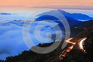 Dramatic cloud with mountain and car traffic light