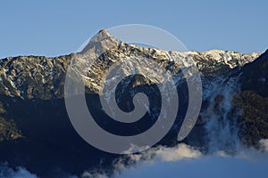 Dramatic cloud with snow peak in yushan.