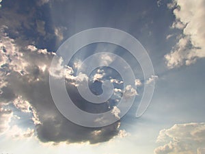 Dramatic clouds backlit by the sun rays, background for a religious theme or text from the Bible