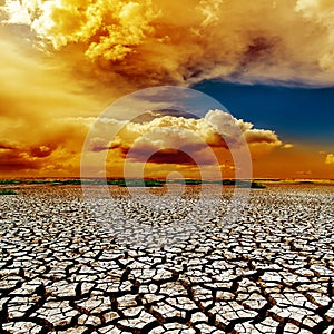 Dramatic clouds over drought earth