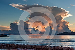 Dramatic clouds over the ocean at sunset. Seychelles La Digue