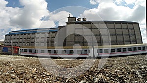 Dramatic clouds over the old derelict warehouse of train statition