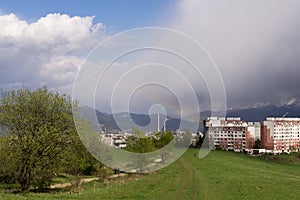 Dramatic clouds, rain and rainbow in distance. Slovakia