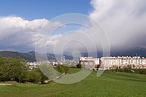 Dramatic clouds, rain and rainbow in distance. Slovakia