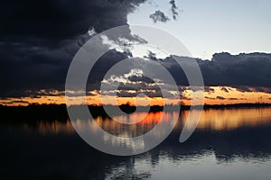 Dramatic clouds during sunset over the river Sava