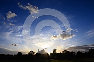 Dramatic clouds at sunset over St Johns Church in Beckenham, London photo