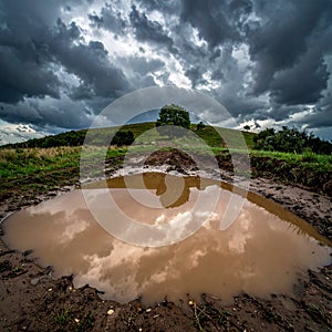 Dramatic Cloudscape Reflection on a Rural Path