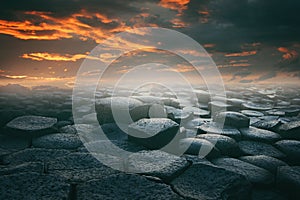 Dramatic cloudscape and stone beach