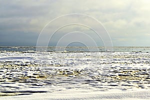 The dramatic cloudy sky over the Baltic sea at the sunset.