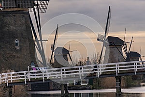 Dramatic cloudy sky over the famous Windmills in Kinderdijk Holland. Sunny summer evening at the windmill village