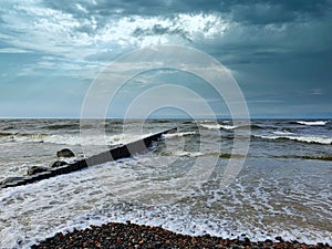 Dramatic cloudy sky over stormy Baltic sea coast