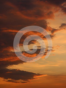 Dramatic colored clouds in sky with sunset colors